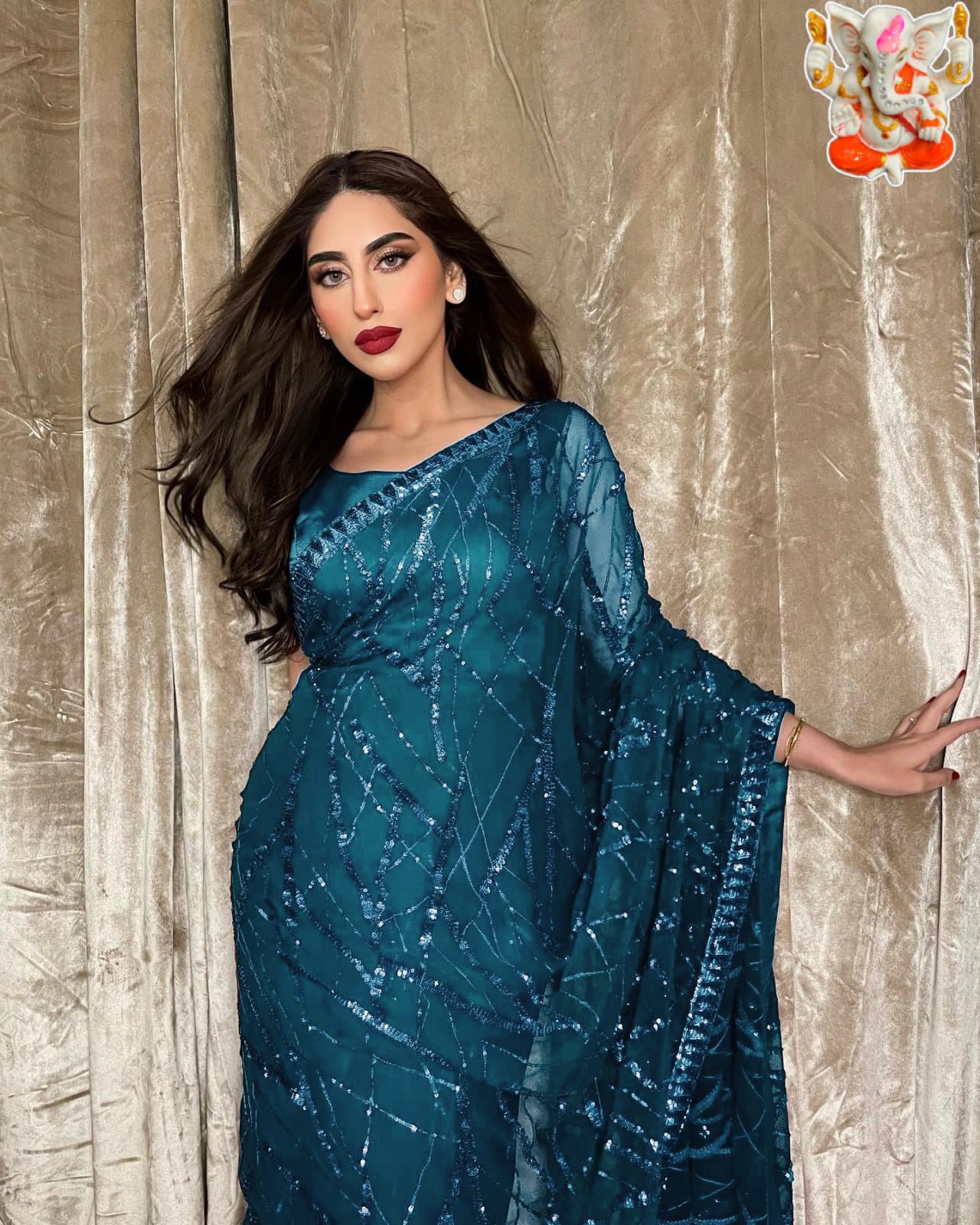 Classic and elegant, this saree will be a perfect addition to your ethnic wardrobe, offering a soothing and pretty wibe the adornment of seqwance work makes it impeccable