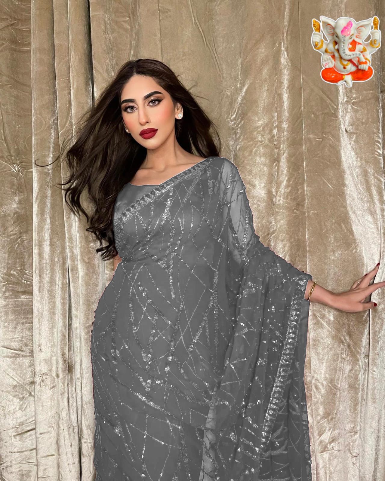 Classic and elegant, this saree will be a perfect addition to your ethnic wardrobe, offering a soothing and pretty wibe the adornment of seqwance work makes it impeccable